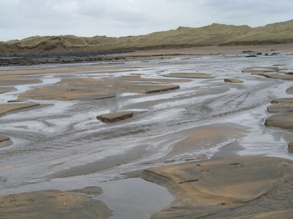 Caher River flows onto Fanore Beach