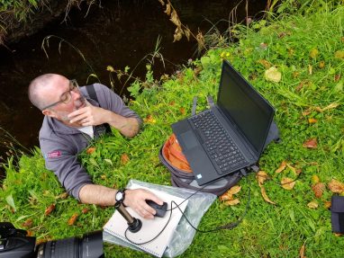 Dr Tiernan Henry stand up river desk